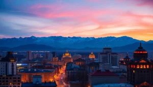 Experience the stunning skyline of Almaty, Kazakhstan at dusk from https://albmaftoh.com, highlighting majestic mountains.
